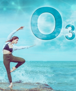A picture with a young person stretching with her hands up near a sea with splashes of water and ozone O3 symbol in the sky.